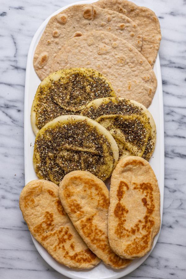 three different types of flatbreads on a platter