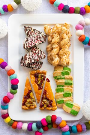 Fancy Schmancy Holiday Cookie Class for 2023 with brightly colored cookies to celebrate the season