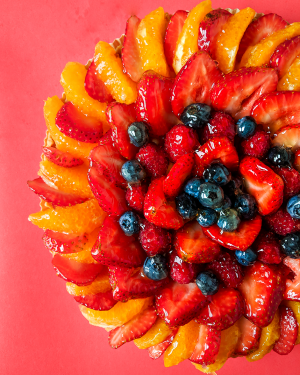 Fresh fruit tart with strawberries, oranges, blueberries, and raspberries made in a BAKE! Ann Arbor baking and cooking class