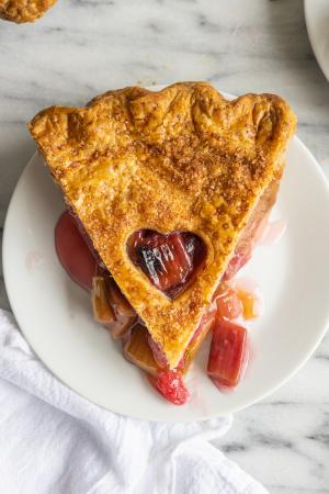 An overhead shot of a slice of Rhubarb Pie on a white plate. 