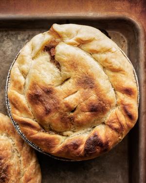 an overhead view of a pot pie on a sheet tray